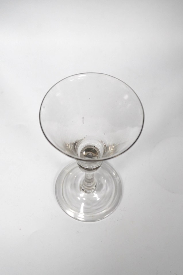 A balustroid wine glass, c.1740, with round funnel bowl, teared knop stem, folded foot, 17cm high. Condition - good